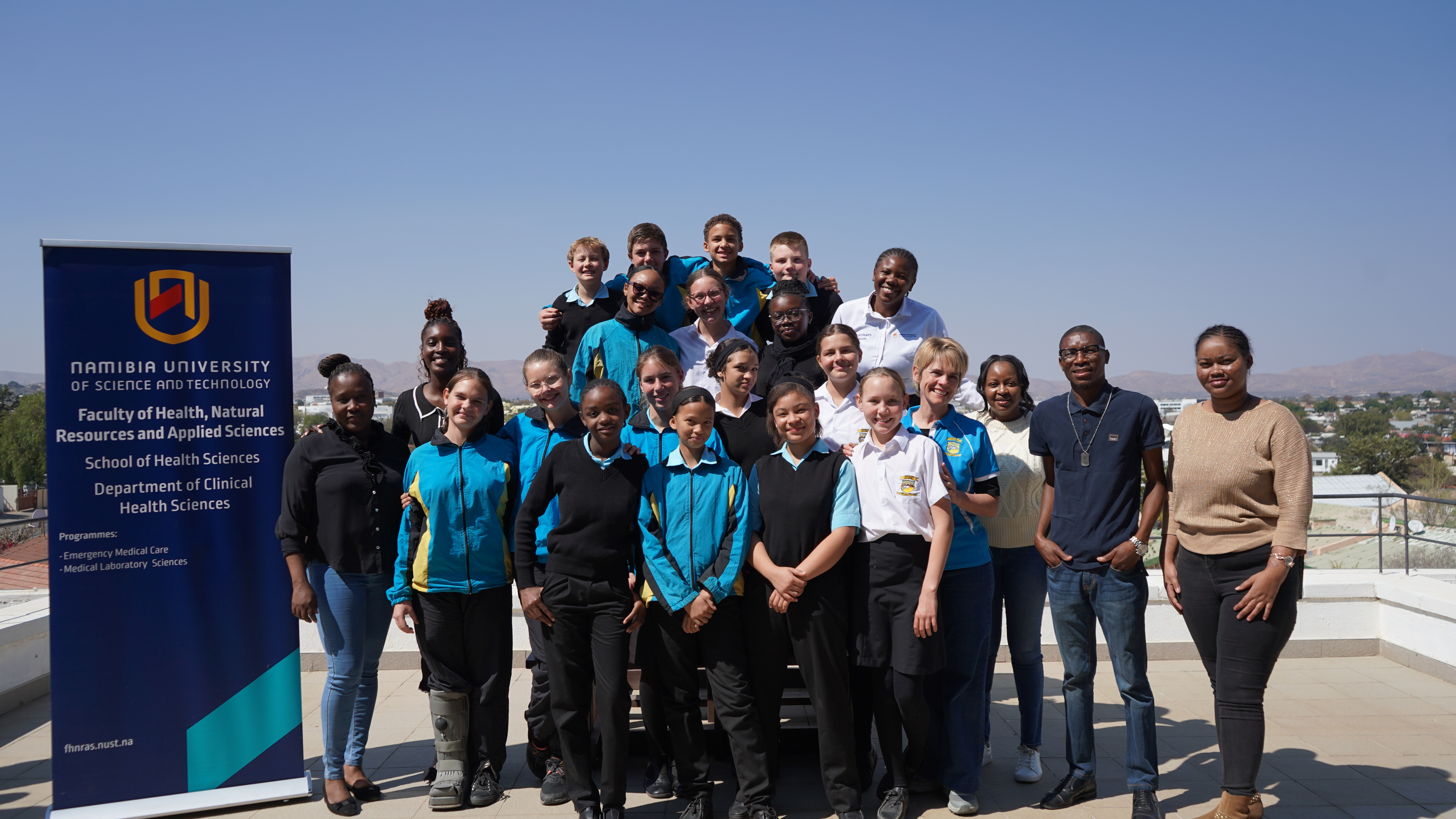 Group photo of kids and lab techs at NUST Namibia