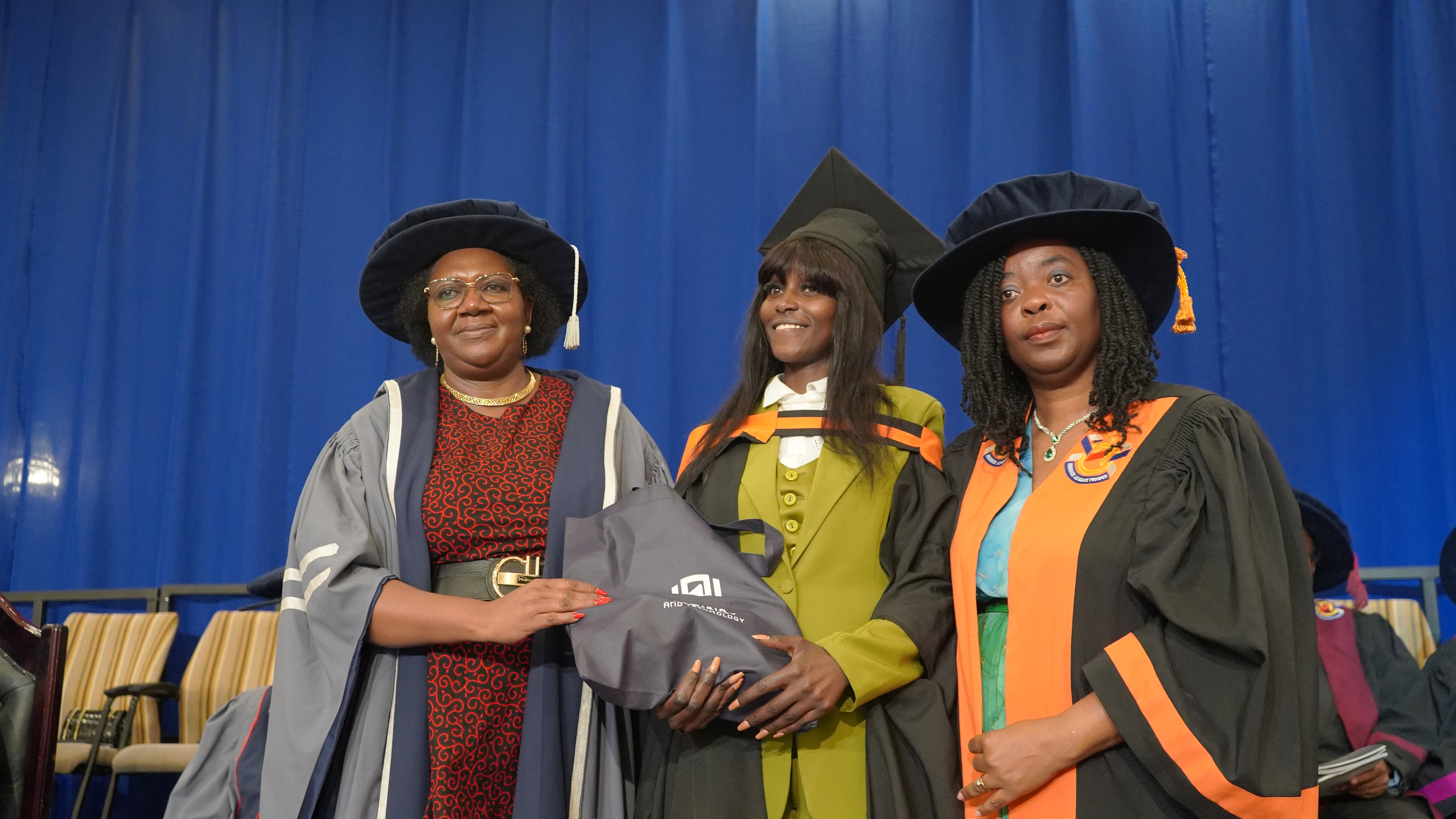 Leila with chair person and prof semente