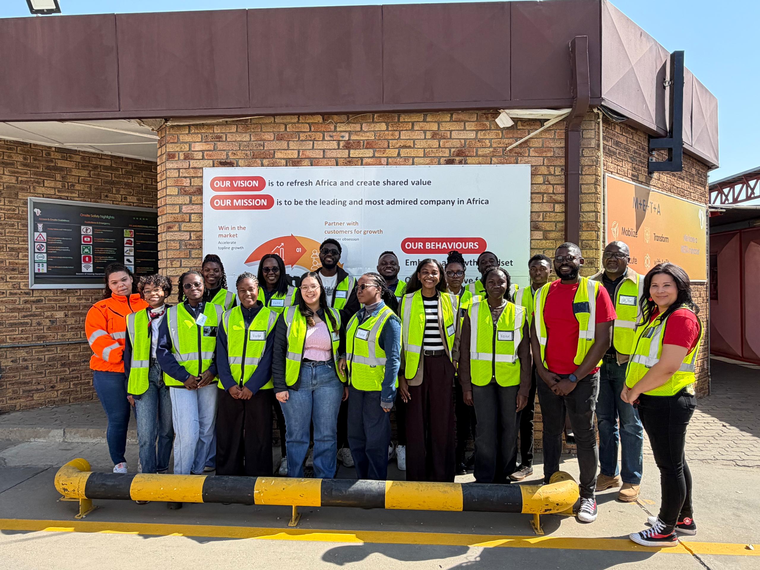Group photo of the students at the Coca-Cola factory