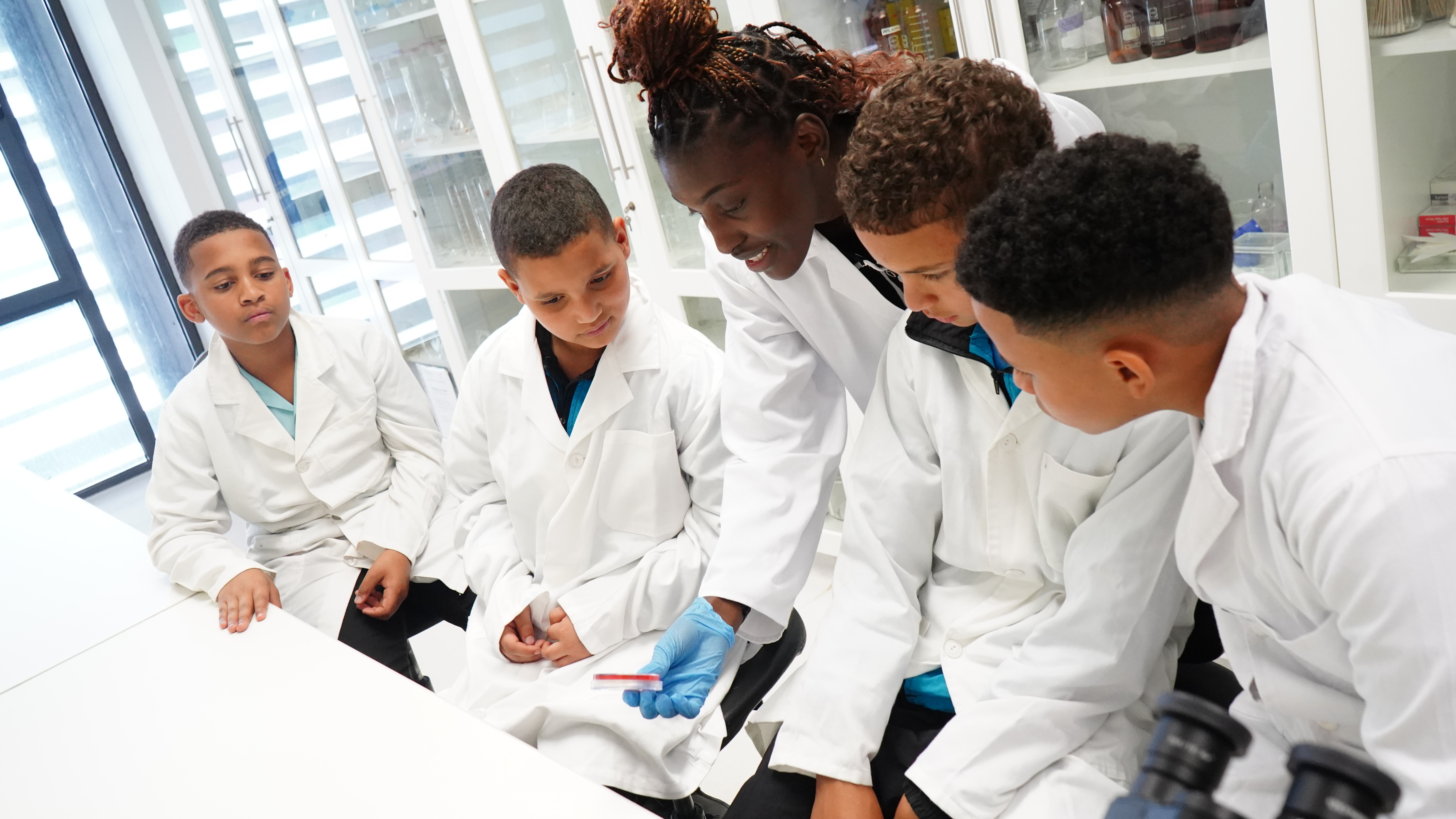 Showing sample to school kids