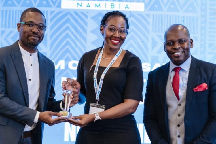 Khumalo Kapelwa, Acting Manager for NUST’s Cooperative Education Department (left), accepting the award for the Highest Student Placement at the Institute for People Management (IPM) Conference. The award was handed over by Lisa Matomola, IPM President, together with Human Resources Professional, Yangeni Chendela.