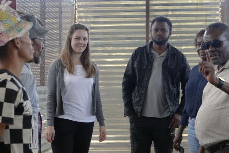 Prof James Katende, NUST’s Renewable Energy Systems expert explaining something to a group of people